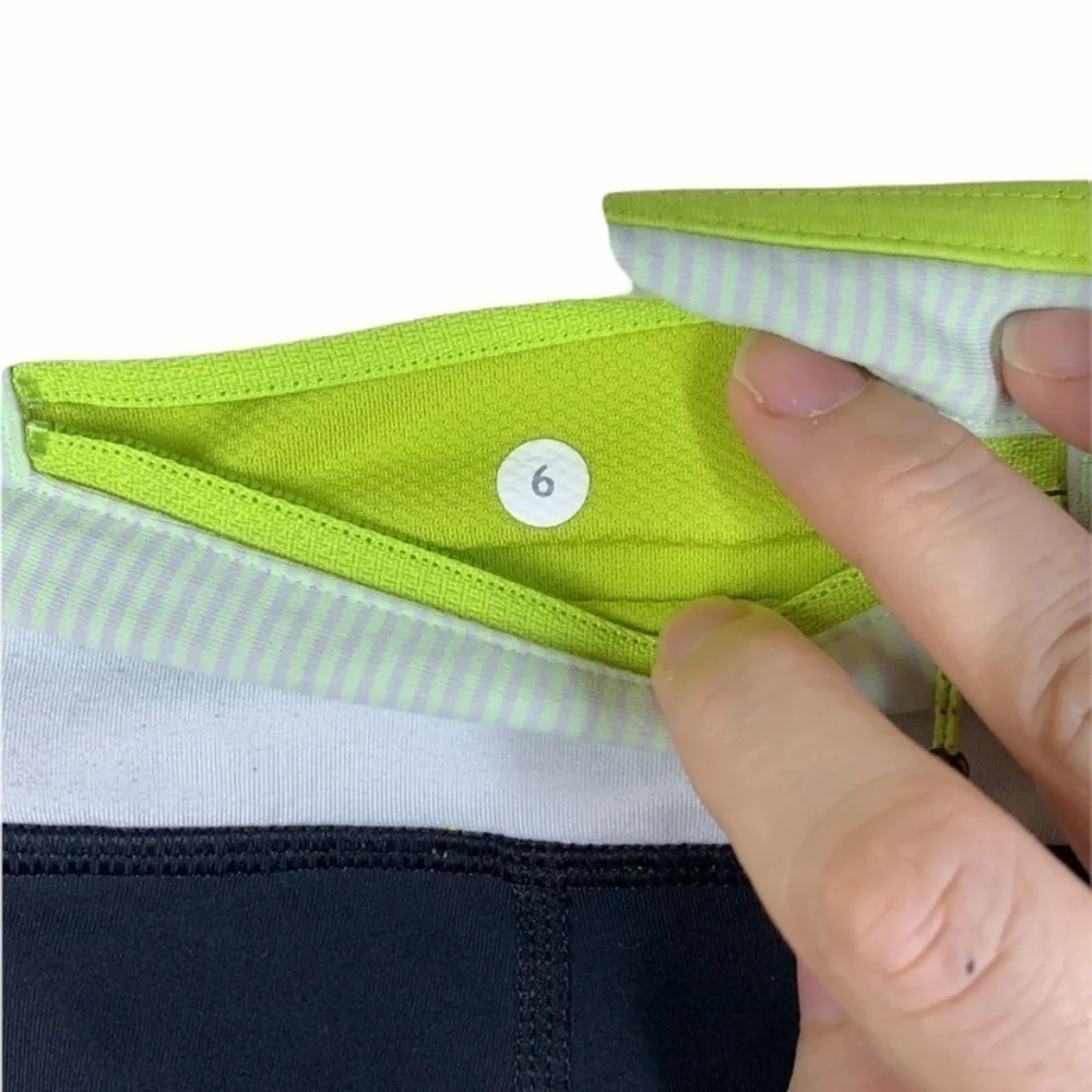 Lululemon black and yellow skull soul cycle crops